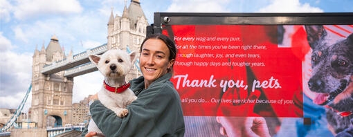 England footballer Lucy Bronze and a West Highland Terrier at Tower Bridge